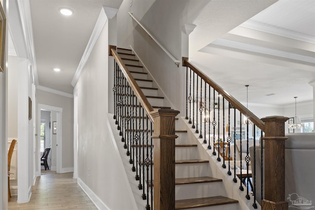 stairway featuring wood-type flooring and ornamental molding