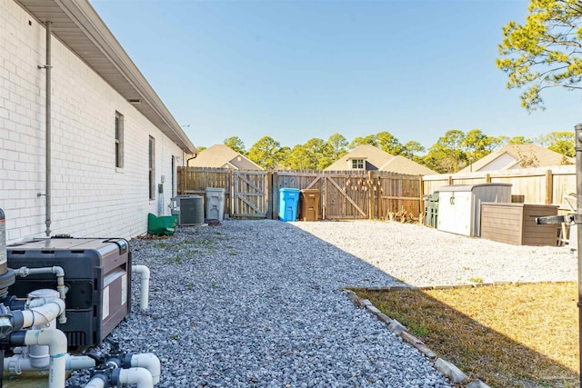 view of yard with central air condition unit