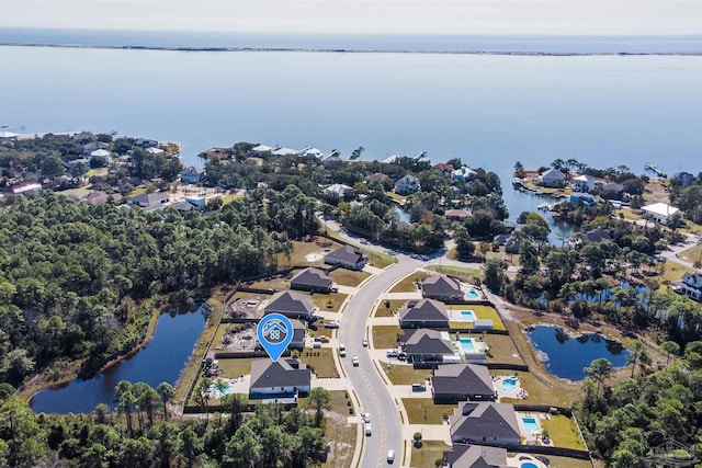 birds eye view of property featuring a water view