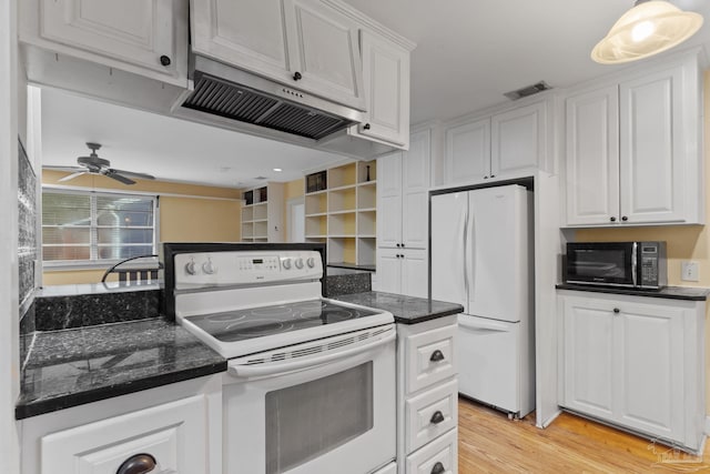 kitchen with light wood-type flooring, white appliances, visible vents, and white cabinets