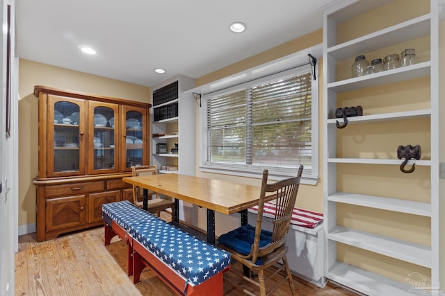 dining room with recessed lighting and light wood finished floors