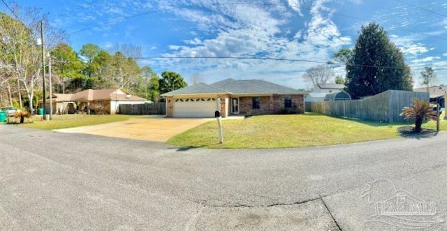 ranch-style house featuring a front lawn, concrete driveway, fence, and an attached garage