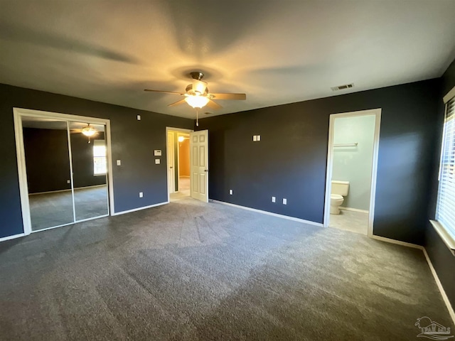 unfurnished bedroom with a ceiling fan, baseboards, visible vents, and carpet flooring