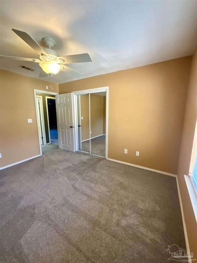 unfurnished bedroom featuring a closet, visible vents, ceiling fan, and baseboards