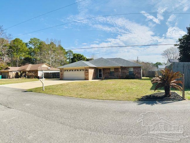 ranch-style house with a garage, concrete driveway, fence, and a front lawn