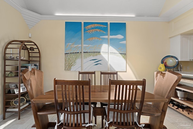 dining space featuring ornamental molding