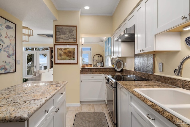 kitchen with stainless steel range with electric stovetop, under cabinet range hood, a sink, crown molding, and light stone countertops