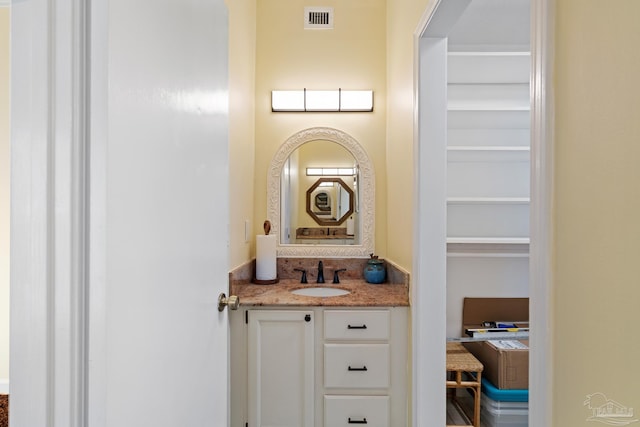 bathroom featuring visible vents and vanity