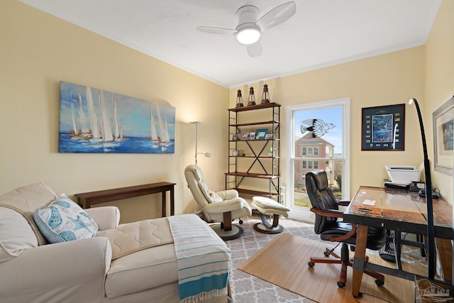 office featuring a ceiling fan and crown molding