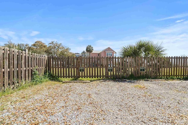 view of gate featuring fence