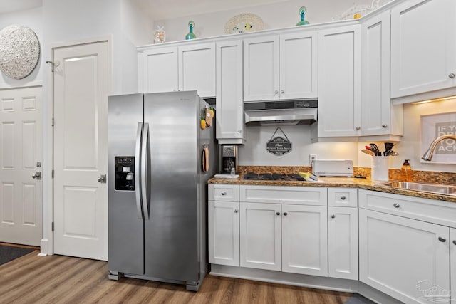 217 W Jackson St Unit 12, Pensacola, FL 32501 - kitchen featuring white cabinetry, under cabinet range hood, appliances with stainless steel finishes, a sink, and wood finished floors