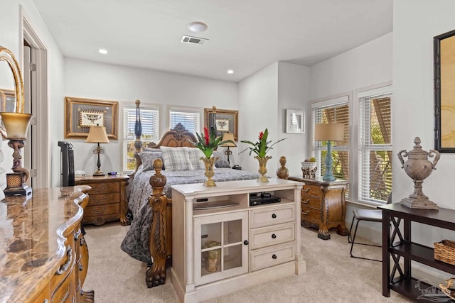 217 W Jackson St Unit 12, Pensacola, FL 32501 - bedroom featuring light colored carpet, multiple windows, visible vents, and recessed lighting