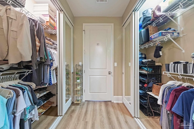 217 W Jackson St Unit 12, Pensacola, FL 32501 - spacious closet with wood finished floors and visible vents