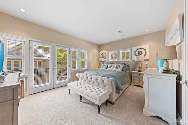 217 W Jackson St Unit 12, Pensacola, FL 32501 - bedroom featuring visible vents, access to exterior, recessed lighting, and light colored carpet