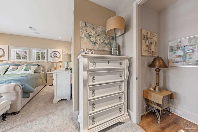 217 W Jackson St Unit 12, Pensacola, FL 32501 - bedroom featuring visible vents, baseboards, and wood finished floors