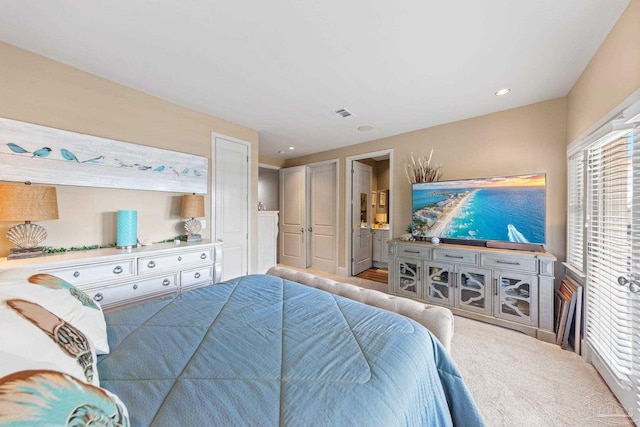 217 W Jackson St Unit 12, Pensacola, FL 32501 - carpeted bedroom with recessed lighting, visible vents, and connected bathroom