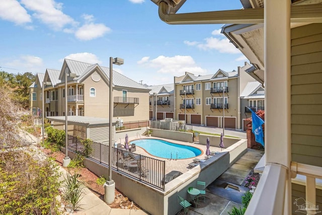217 W Jackson St Unit 12, Pensacola, FL 32501 - community pool featuring a patio and a residential view