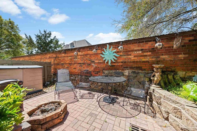 217 W Jackson St Unit 12, Pensacola, FL 32501 - view of patio with a fire pit and fence