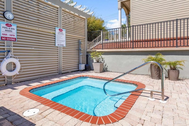 217 W Jackson St Unit 12, Pensacola, FL 32501 - view of swimming pool featuring a patio