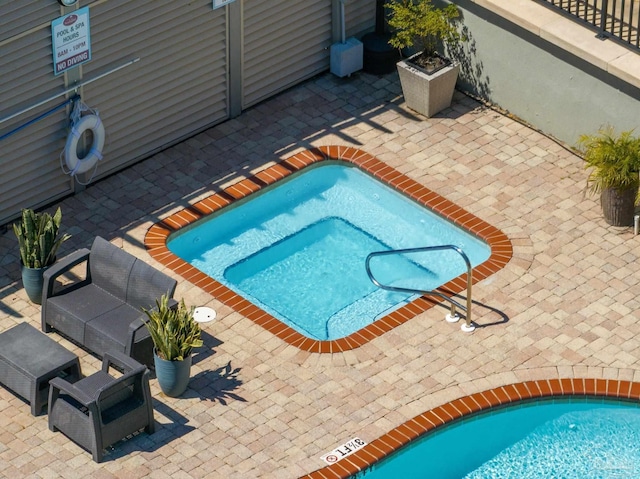 217 W Jackson St Unit 12, Pensacola, FL 32501 - view of pool featuring a patio area