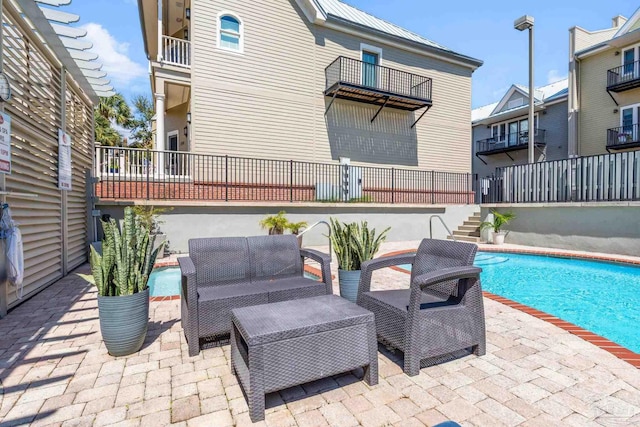 217 W Jackson St Unit 12, Pensacola, FL 32501 - view of patio / terrace with stairway, an outdoor pool, and outdoor lounge area