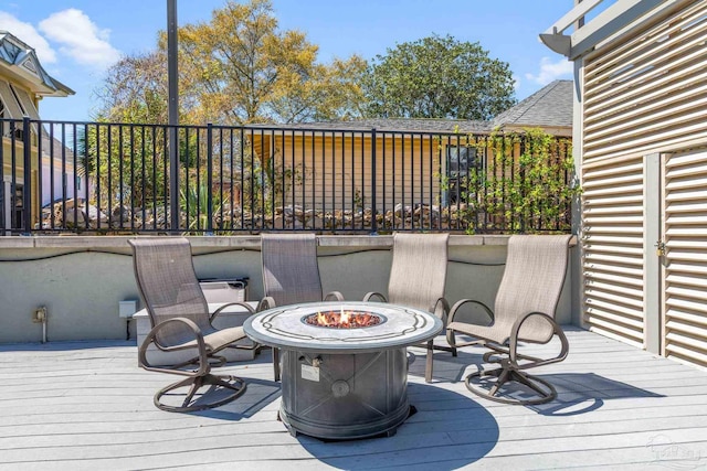 217 W Jackson St Unit 12, Pensacola, FL 32501 - wooden deck with a fire pit
