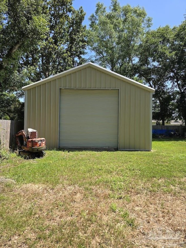 garage featuring a yard