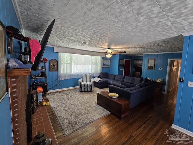 living room with dark hardwood / wood-style floors and ceiling fan