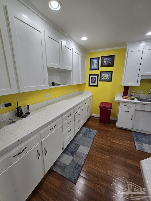 kitchen featuring white cabinetry, tile countertops, and dark wood-type flooring