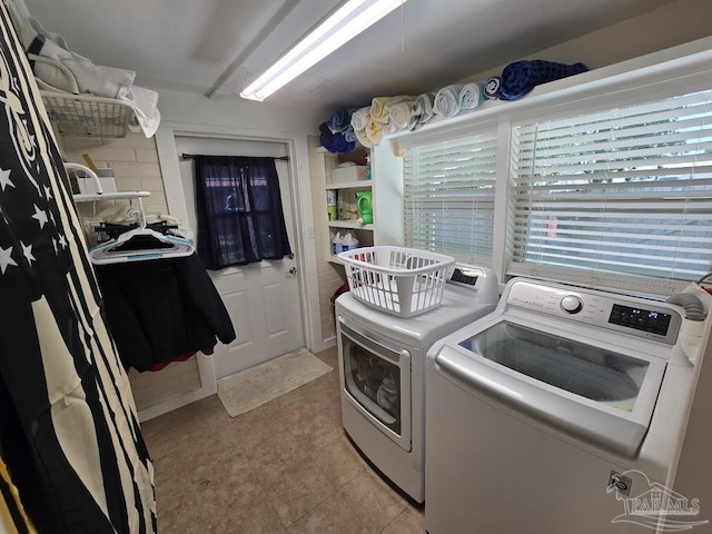 clothes washing area with independent washer and dryer