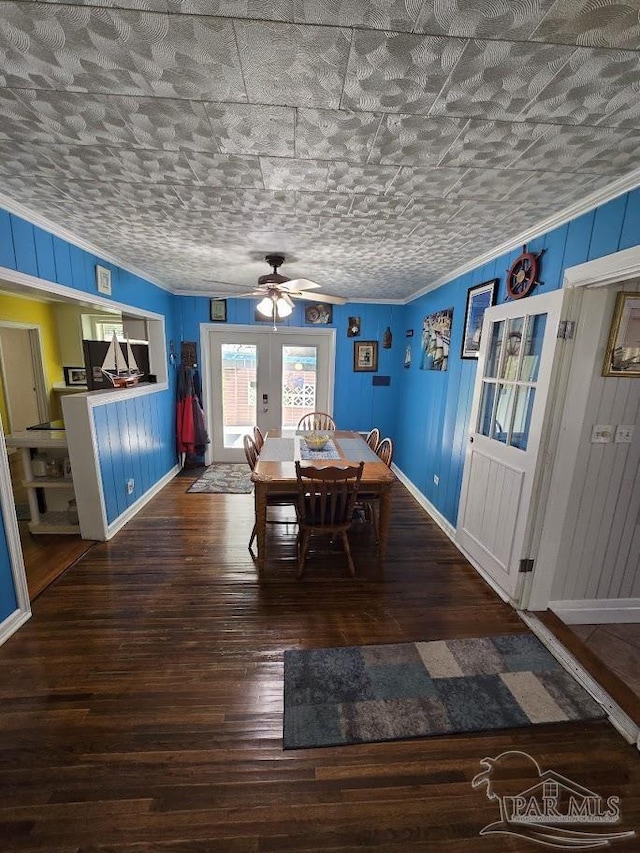 dining room with hardwood / wood-style flooring, ceiling fan, crown molding, and french doors