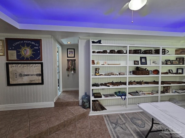 spacious closet featuring dark tile patterned floors