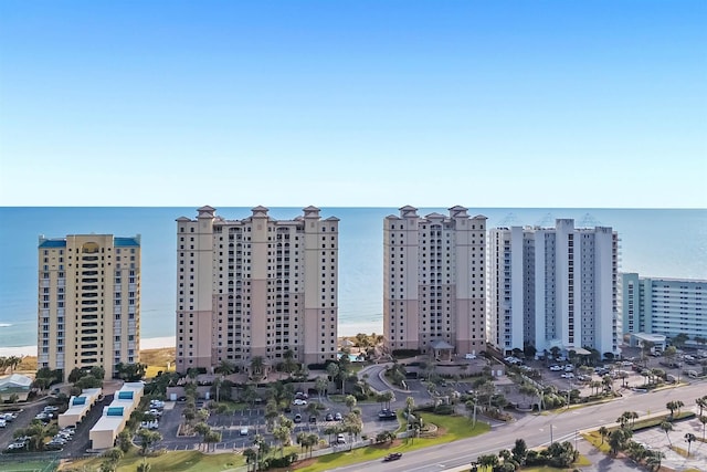 birds eye view of property with a view of city and a water view