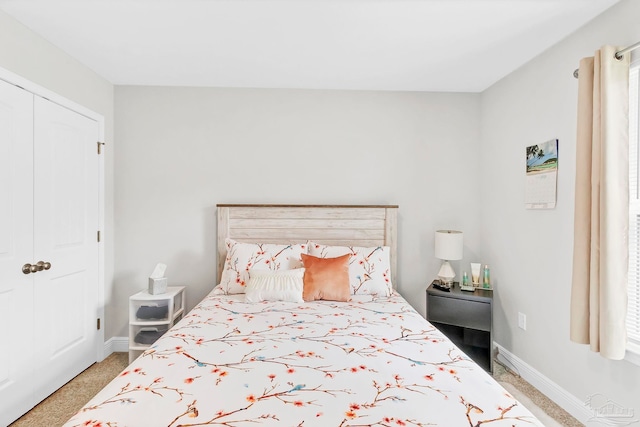 bedroom with baseboards and a closet