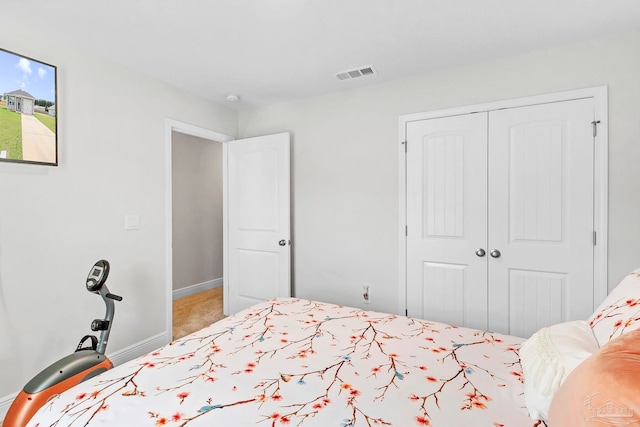bedroom featuring a closet and baseboards