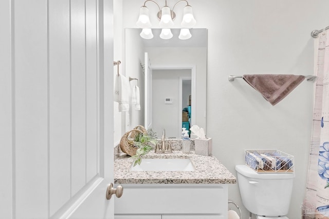 full bathroom featuring vanity and toilet
