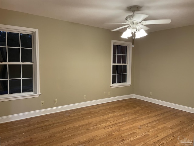 3036 Laurel Dr, Gulf Breeze, FL 32563 - unfurnished room featuring ceiling fan, wood finished floors, and baseboards