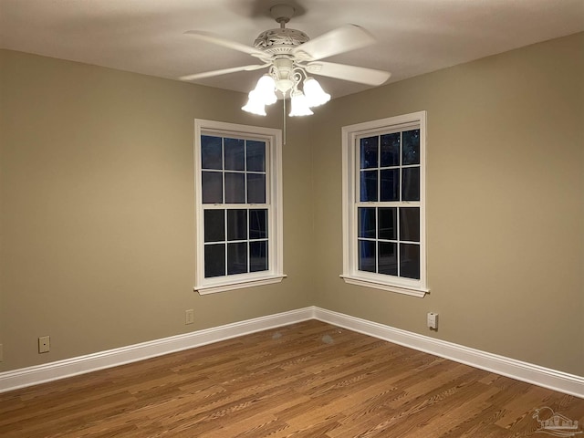 3036 Laurel Dr, Gulf Breeze, FL 32563 - empty room with wood finished floors, ceiling fan, and baseboards