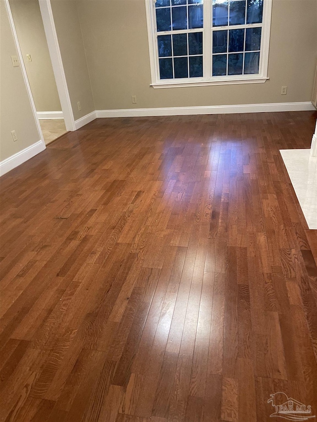 3036 Laurel Dr, Gulf Breeze, FL 32563 - empty room featuring dark wood-style flooring and baseboards