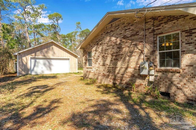 3036 Laurel Dr, Gulf Breeze, FL 32563 - view of property exterior featuring a detached garage, an outbuilding, and brick siding