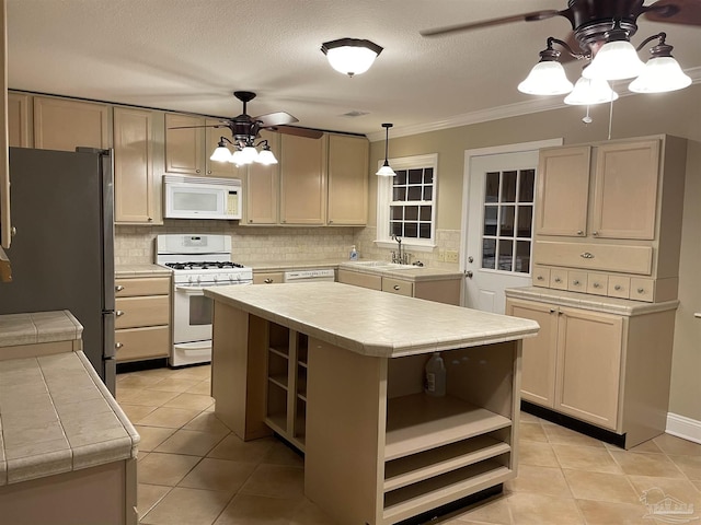 3036 Laurel Dr, Gulf Breeze, FL 32563 - kitchen with open shelves, white appliances, ceiling fan, a sink, and ornamental molding