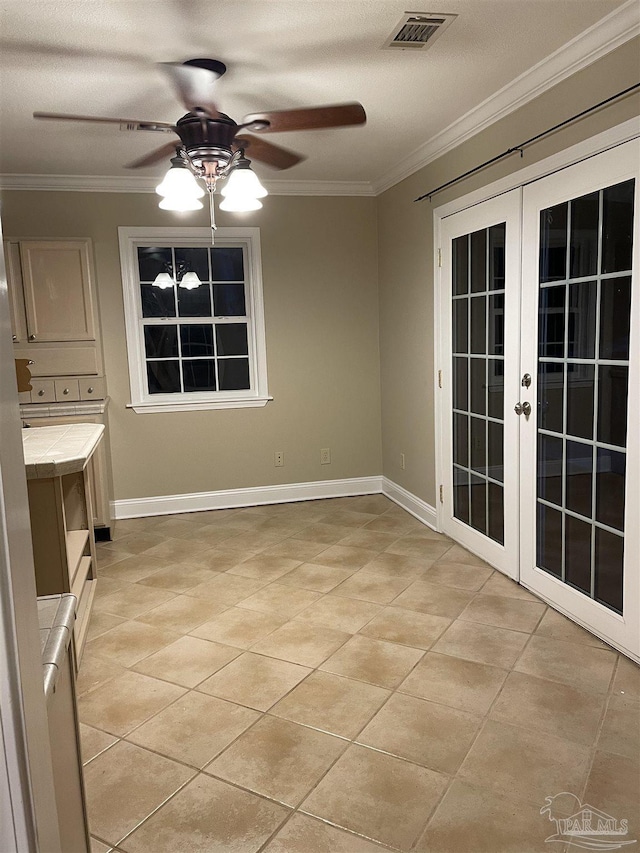 3036 Laurel Dr, Gulf Breeze, FL 32563 - unfurnished dining area featuring french doors, a ceiling fan, ornamental molding, light tile patterned floors, and baseboards