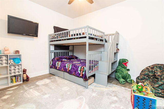 bedroom with hardwood / wood-style flooring and ceiling fan