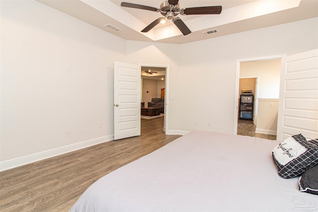 bedroom with hardwood / wood-style floors and ceiling fan