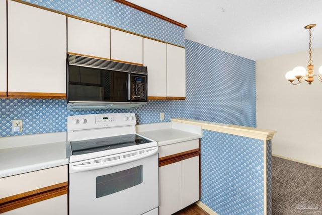 kitchen featuring electric stove, white cabinetry, pendant lighting, and an inviting chandelier