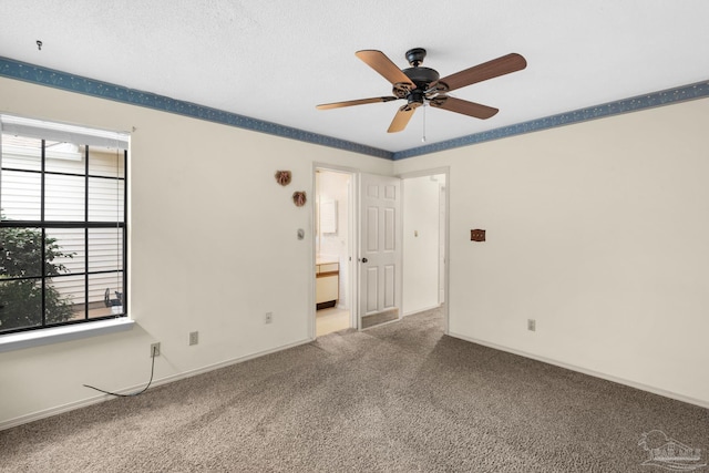 unfurnished room with carpet, a textured ceiling, and ceiling fan