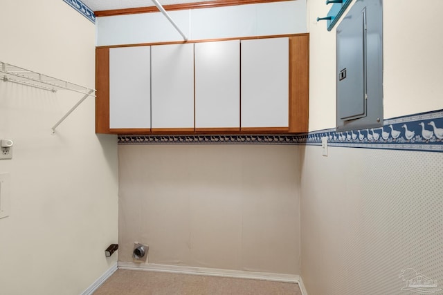 clothes washing area featuring electric panel, light carpet, cabinets, and hookup for an electric dryer