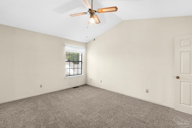 empty room with carpet, ceiling fan, and lofted ceiling