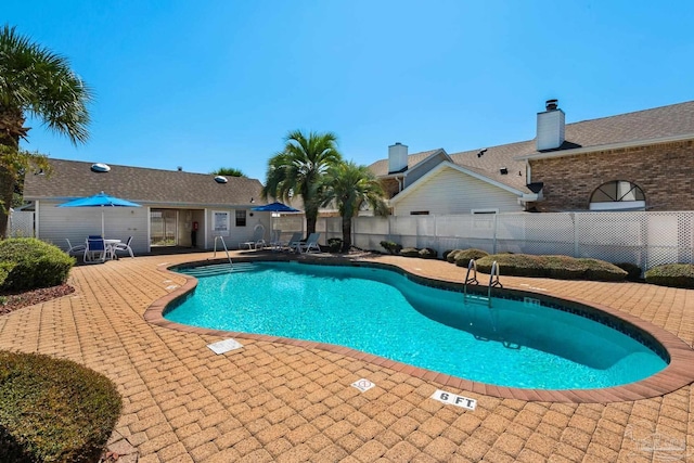 view of swimming pool featuring a patio area