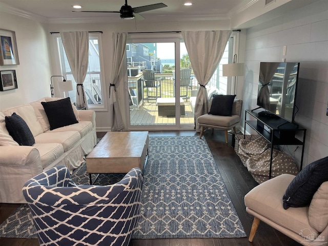 living room featuring visible vents, crown molding, ceiling fan, recessed lighting, and wood finished floors